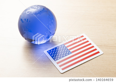 A glass globe and the American flag A glass globe and the American flag 140164659