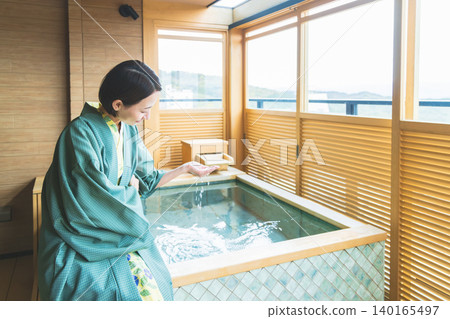 A woman in a yukata at a hot spring inn 140165497
