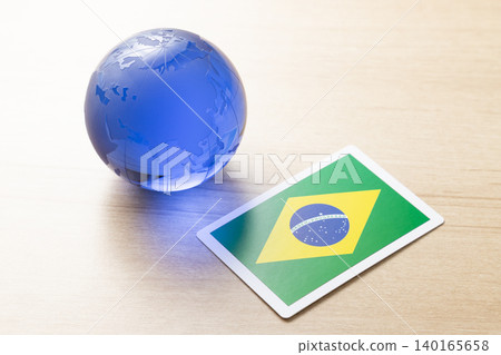 A glass globe and the Brazilian flag A glass globe and the Brazilian flag 140165658