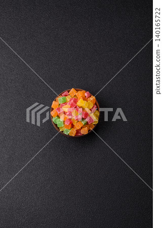 Candied fruit in colorful cubes as an ingredient for baked goods and sweets. Candied fruit Candied fruit in colorful cubes as an ingredient for baked goods and sweets. Candied fruit 140165722