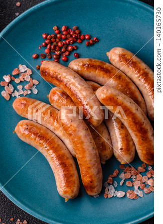 Grilled or barbecued chicken sausages for the dinner table. Grilled sausages Grilled or barbecued chicken sausages for the dinner table. Grilled sausages 140165730