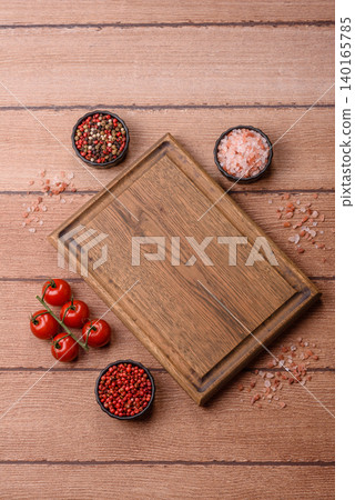 Empty wooden cutting board for preparing ingredients for home cooking. An empty cutting board Empty wooden cutting board for preparing ingredients for home cooking. An empty cutting board 140165785