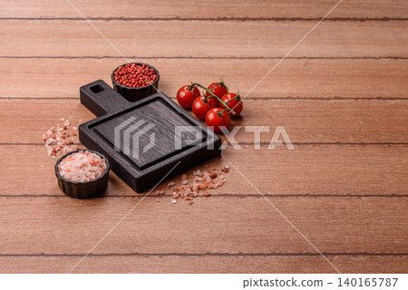 Empty wooden cutting board for preparing ingredients for home cooking. An empty cutting board 140165787