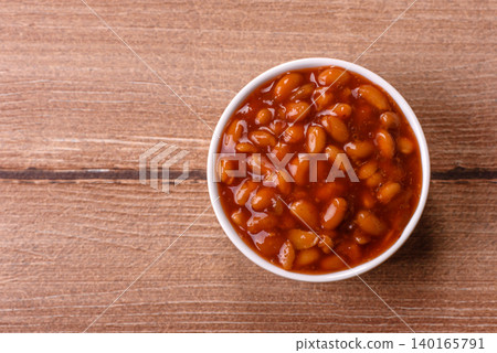 Beans in tomato sauce, a canned stew for the dinner table. Beans in tomato sauce Beans in tomato sauce, a canned stew for the dinner table. Beans in tomato sauce 140165791