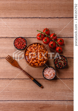 Beans in tomato sauce, a canned stew for the dinner table. Beans in tomato sauce Beans in tomato sauce, a canned stew for the dinner table. Beans in tomato sauce 140165792