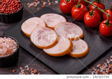 Slices of cooked chicken sausage for sandwiches and antipasto for dinner. Sausage slices 140165795