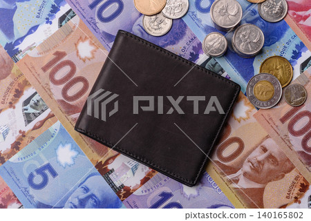 Canada, Canadian dollar, paper money and coins, financing exchange, trade. Canadian currency Canada, Canadian dollar, paper money and coins, financing exchange, trade. Canadian currency 140165802