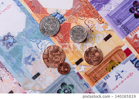 Qatar paper money, the Qatari riyal as a tool for financial transactions and trade. Qatari money Qatar paper money, the Qatari riyal as a tool for financial transactions and trade. Qatari money 140165819