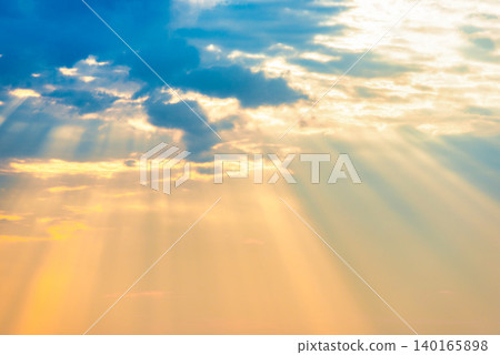 Sunset sky with sun rays through clouds Sunset sky with sun rays through clouds 140165898
