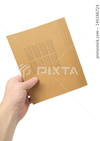 a person holds a notebook with a multiplication table on the back of the cover a person holds a notebook with a multiplication table on the back of the cover 140166724