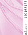 Smooth elegant pink silk or satin texture as wedding background. Luxurious background design 140168175