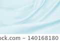 Smooth elegant blue silk or satin luxury cloth texture as abstract background. Luxurious background design 140168180