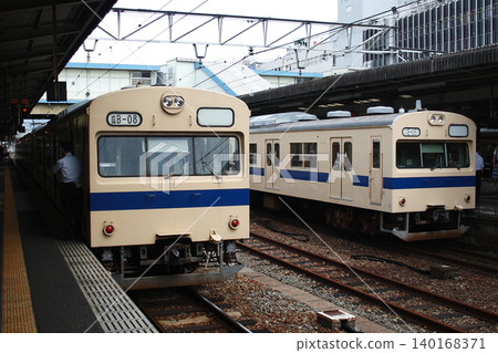 Sanyo Main Line 103 series train parked at Hiroshima Station Sanyo Main Line 103 series train parked at Hiroshima Station 140168371