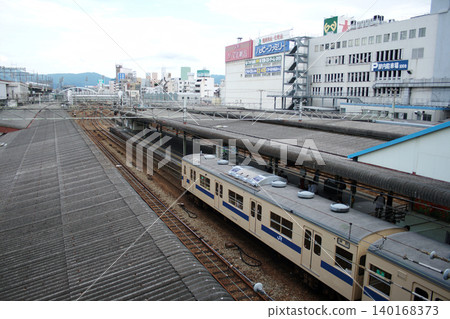 Sanyo Main Line 103 series train parked at Hiroshima Station Sanyo Main Line 103 series train parked at Hiroshima Station 140168373
