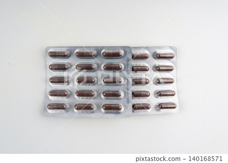 Iron capsule isolated, Fe pills, brown hemoglobin supplement tablets, vitamin capsules on white Iron capsule isolated, Fe pills, brown hemoglobin supplement tablets, vitamin capsules on white 140168571