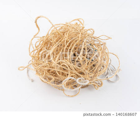 String piece isolated, jute rope fragment, part of packaging cord knots, eco-friendly natural rope String piece isolated, jute rope fragment, part of packaging cord knots, eco-friendly natural rope 140168607