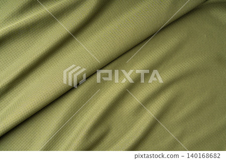 Sport cloth fabric texture background, olive green soccer shirt pattern 140168682
