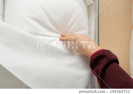Hand touch fabric texture, soft textile cloth background, cotton quality control Hand touch fabric texture, soft textile cloth background, cotton quality control 140168752