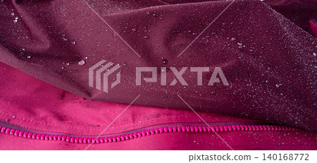 Waterproof fabric texture with rain drops closeup Waterproof fabric texture with rain drops closeup 140168772