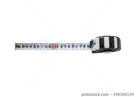 A cutout stock photo of a steel measuring tape with a transparent background, viewed from directly above. A cutout stock photo of a steel measuring tape with a transparent background, viewed from directly above. 140169134