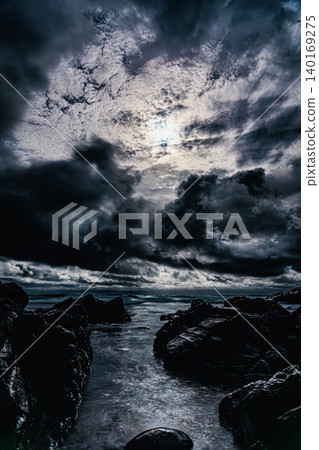 Moonlight shining through the clouds and the sea of Tanegashima 140169275
