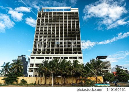 Unfinished hotel in Negombo, crisis in tourism symbol, editorial image Unfinished hotel in Negombo, crisis in tourism symbol, editorial image 140169661