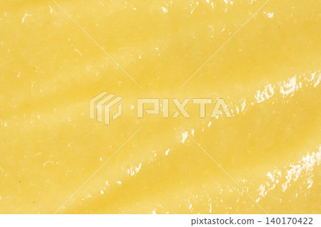 Abstract background of fresh blended yellow fruit mash. Abstract background of fresh blended yellow fruit mash. 140170422