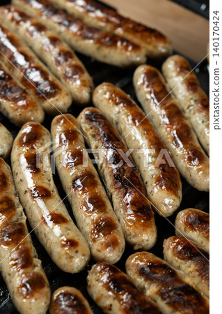 Home BBQ. Grilling Sausages on Open Contact Grill Plate Home BBQ. Grilling Sausages on Open Contact Grill Plate 140170424