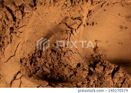 Abstract culinary background with organic cocoa powder waves Abstract culinary background with organic cocoa powder waves 140170574