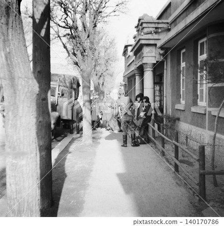 Old photograph, 1943, Manchuria during the Second Sino-Japanese War: Japanese soldiers (carrying Japanese swords) in front of the Aburaya Inn in Liaoyang City. Old photograph, 1943, Manchuria during the Second Sino-Japanese War: Japanese soldiers (carrying Japanese swords) in front of the Aburaya Inn in Liaoyang City. 140170786