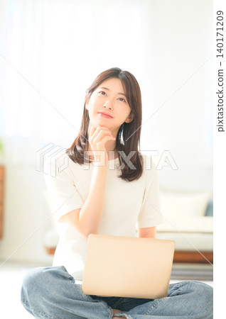 Japanese woman troubled with her laptop Japanese woman troubled with her laptop 140171209