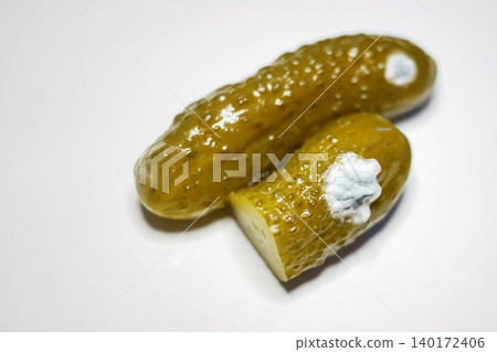 Spoiled Pickles with Mold. Food Safety, Fermentation, and Microbiology Concept Spoiled Pickles with Mold. Food Safety, Fermentation, and Microbiology Concept 140172406