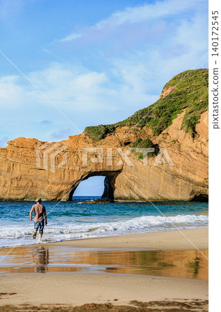 The beautiful scenery of Tanegashima Island, with its Pacific waves and unique rock formations. 140172545