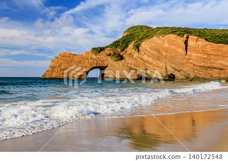 A breathtaking view created by the blue sea and the elephant's watering hole rock. 140172548