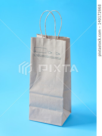 A brown paper bag for shopping on background. A brown paper bag for shopping on background. 140172668