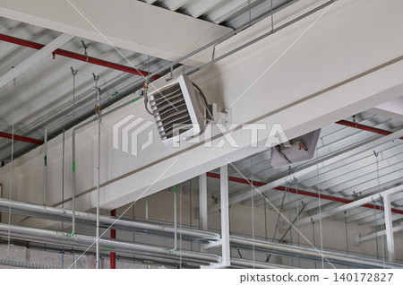Ceiling-mounted AC unit in industrial space Ceiling-mounted AC unit in industrial space 140172827