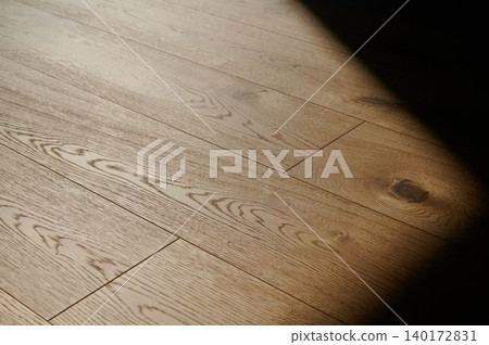 Light dancing on an elegant wooden floor Light dancing on an elegant wooden floor 140172831