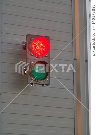 Traffic light glows red and green urbanly Traffic light glows red and green urbanly 140172853