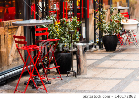 Red bistro chairs invite moments of cafe joy Red bistro chairs invite moments of cafe joy 140172868