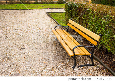 Charming park bench invites moments of peace Charming park bench invites moments of peace 140172870