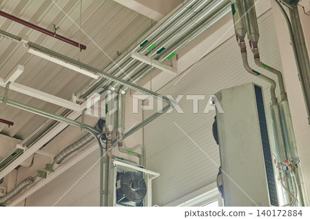 Industrial pipes and structures in a modern space Industrial pipes and structures in a modern space 140172884