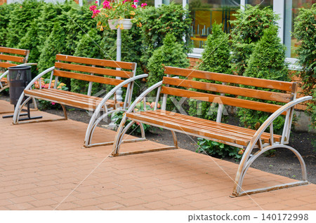 Park benches under bright spring sunlight Park benches under bright spring sunlight 140172998
