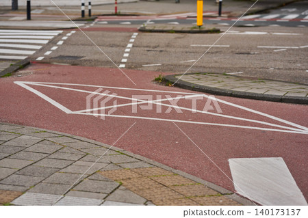 Streets of Amsterdam Display the Vibrant Design of Bike Paths Among Charming City Architecture 140173137