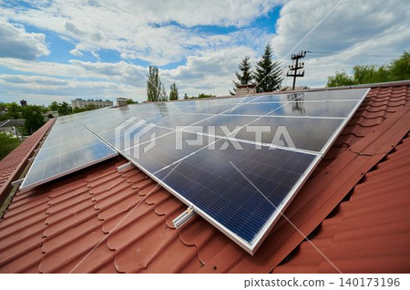 Harnessing sunlight on a rooftop with solar panels 140173196