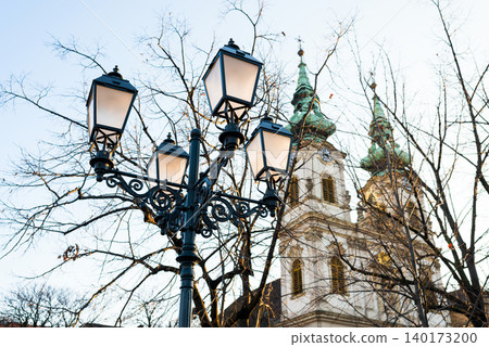 Historic church framed by lovely lamps Historic church framed by lovely lamps 140173200
