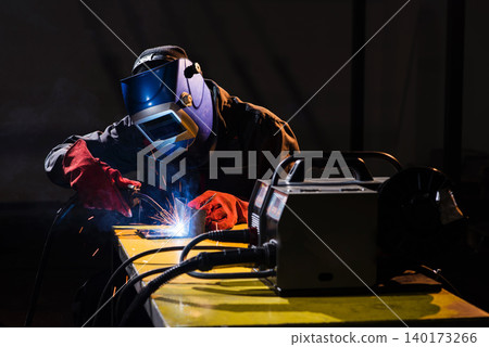 Crafting sparks in the dark welding workshop Crafting sparks in the dark welding workshop 140173266