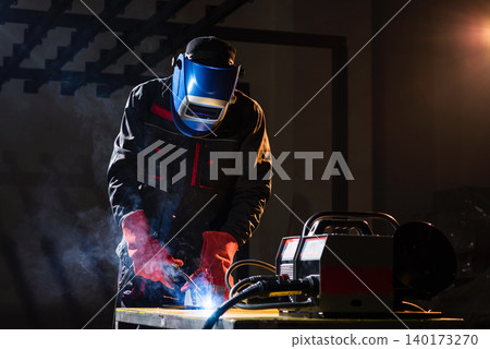 Welder crafts stunning designs in workshop Welder crafts stunning designs in workshop 140173270