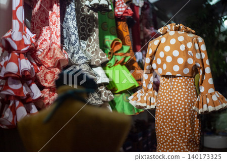 typical flamenco spanish dress with polka dots on a mannequin typical flamenco spanish dress with polka dots on a mannequin 140173325