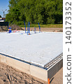 Insulated foundation slab with utility conduits prepared for energy efficient house construction site 140173352