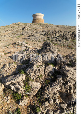 Defensive tower against pirates on a hill in the spanish island of Menorca Defensive tower against pirates on a hill in the spanish island of Menorca 140173711
